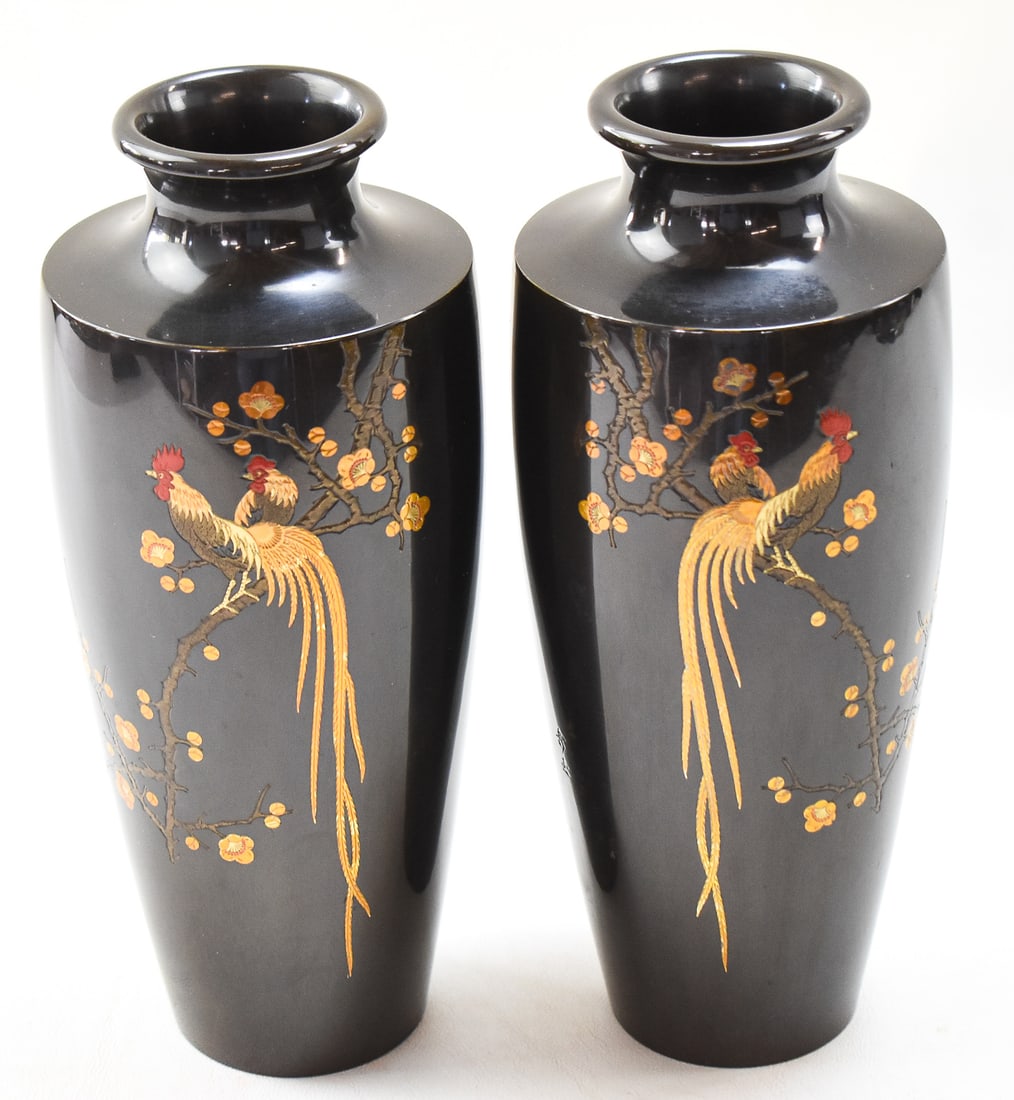 PAIR OF JAPANESE SIGNED MIXED-METAL BRONZE VASES: A pair of Japanese mixed-metal bronze vases with an inlayed design of roosters roosting in a plum tree, circa 1900. Each vase is inscribed with the artists signature on the side of the vase. Each