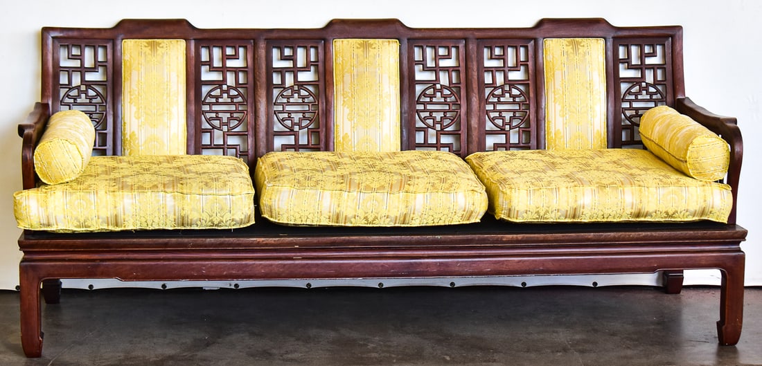 ASIAN CARVED ROSEWOOD LONG SOFA: This couch is carved from solid rosewood with original mid century brocade cushions. The couch measures 30.5" H x 72" W x 22" D.