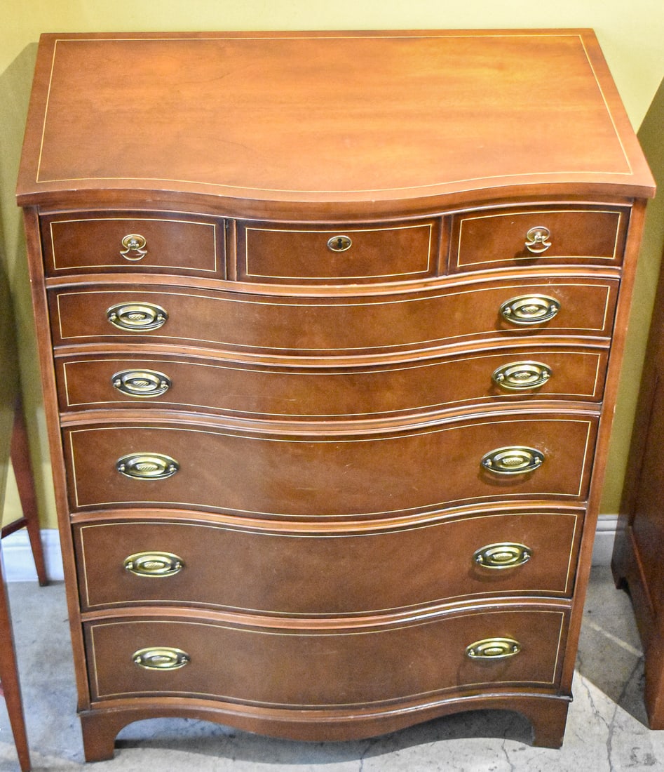 FEDERAL STYLE SERPENTINE FRONT CHEST OF DRAWERS: This chest of drawers is five drawers with a bow front shape. The chest is made of mahogany wood and brass hardware. The chest measures approximately 49" H x 36" W x 21" D.