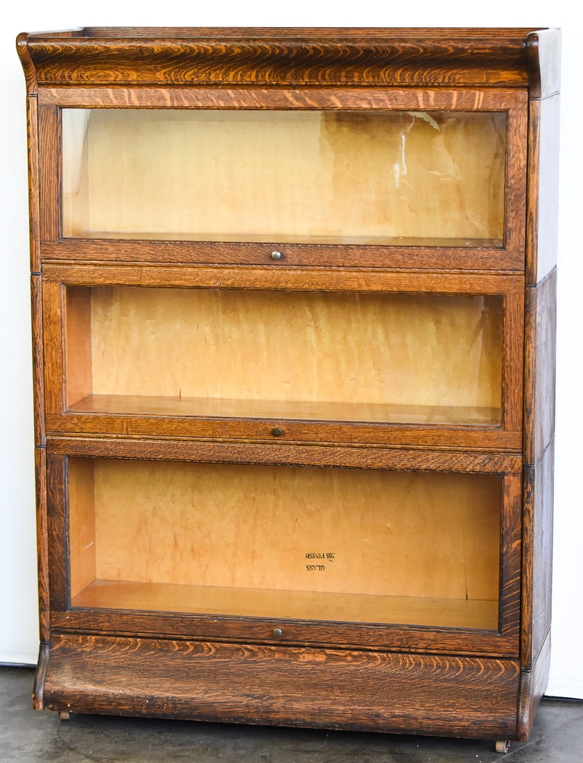 3 STACK BARRISTER BOOKCASE: This bookcase is made of tiger oak by Gevurtz Furniture Company, circa early 20th century. It is three stacks high and measures approximately 47.5" H x 34.5" W x 14.5" D.