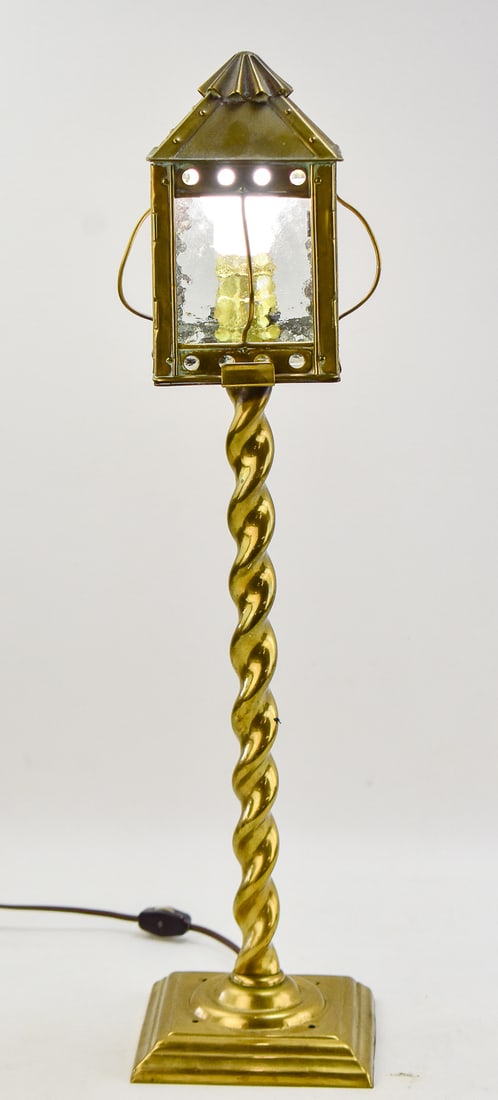 ARTS & CRAFTS STYLE LANTERN TABLE LAMP: This lamp is made of brass and was manufactured circa mid 20th century. Lamp measures 24" H, 5.5" W, 5.5" D.