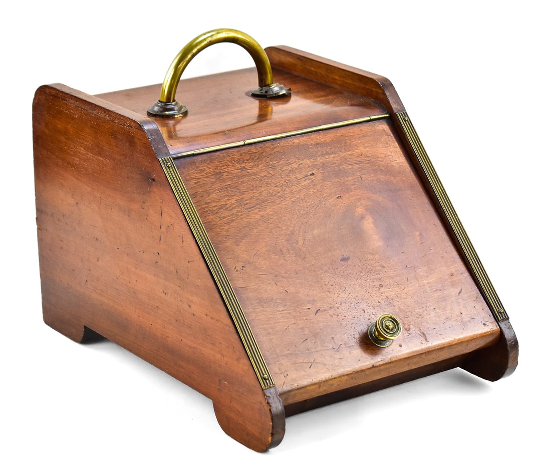 MAHOGANY BRASS COAL SCUTTLE: A mahogany and brass coal scuttle with removable metal insert. The item measures approx. 13"H x 12"W x 17"D.