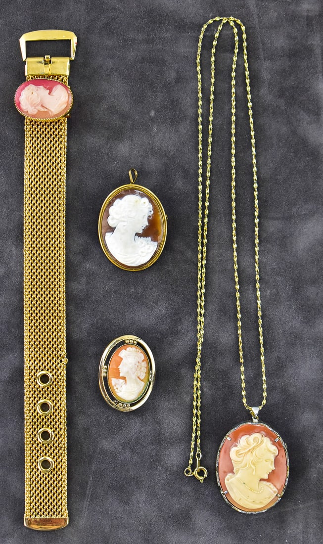 VICTORIAN CAMEO JEWELRY COLLECTION: This lot has four pieces of cameo jewelry; one bracelet, one necklace and two brooch. Two cameos are carved shell and two are modern resin. Largest item measures approx. 1" H x 3.5" W x 0. 5" D.