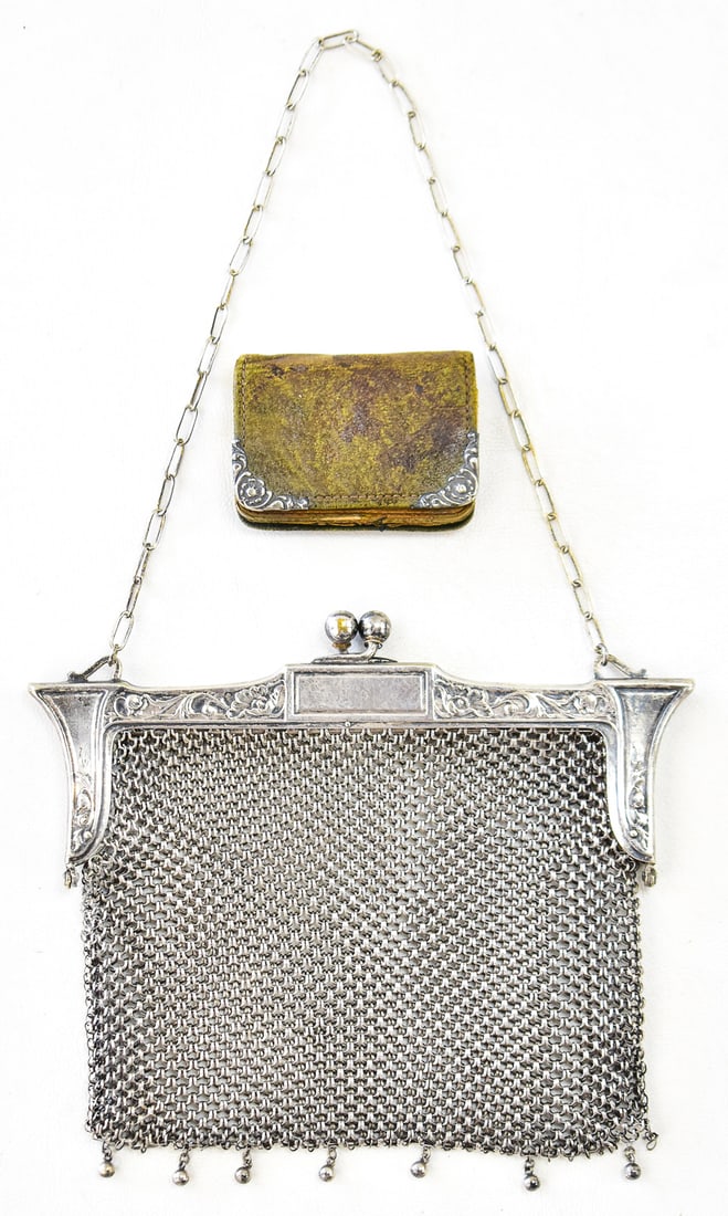 GERMAN SILV ER MESH PURSE & COIN PURSE: Purse one is a purse made of German Silver circa 1920s. Purse two is a small coin purse made of leather with Sterling silver decorative corners. There are initials " E.M.W." draw inside. Purse