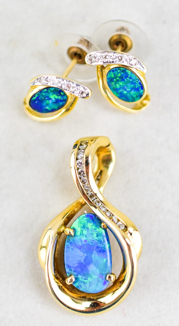 14KT GOLD AUSTRALIAN OPAL PENDANT & EARRINGS: This set has matching earrings and necklace pendant. Both are 14kt yellow gold with Australian opals in them. The pendant has 12 diamonds and each earring has 4 diamonds. The pendant measures