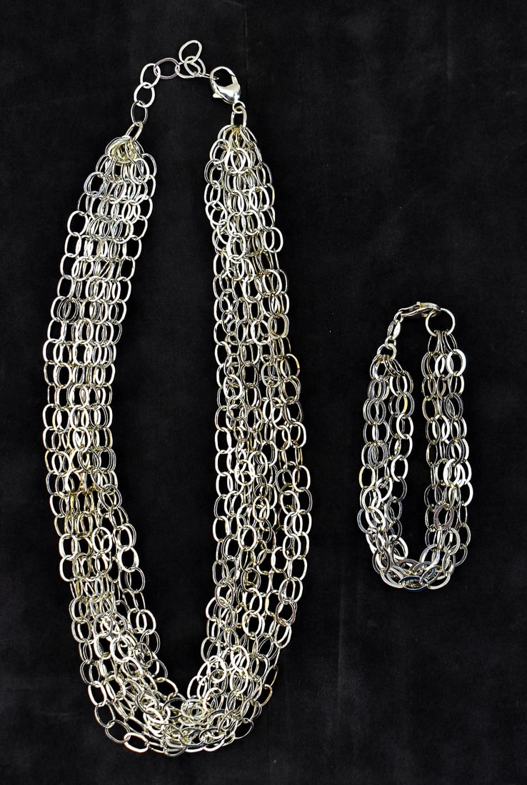 MATCHING STERLING SILVER NECKLACE AND BRACELET: This matching set of sterling silver chain link weighs approximately 58oz. Necklace measures approximately 1" H x 17" W x 0.5" D.