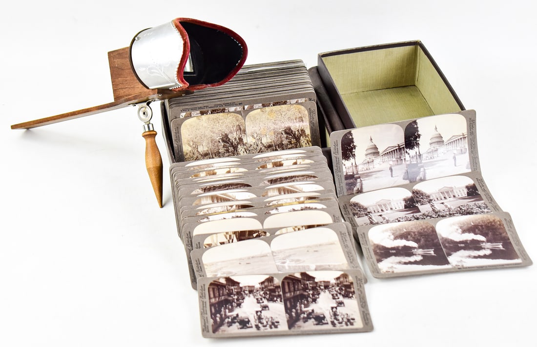 UNDERWOOD & UNDERWOOD "AROUND THE WORLD" STEREOGRAPH BOXED SET W/ MONARCH STEREOSCOPE: An "Around The World" faux-book boxed set of approximately 89 stereographs made by Underwood & Underwood, circa 1890s, and a Monarch stereoscope made circa 1904. The boxes set measures approx. 8"