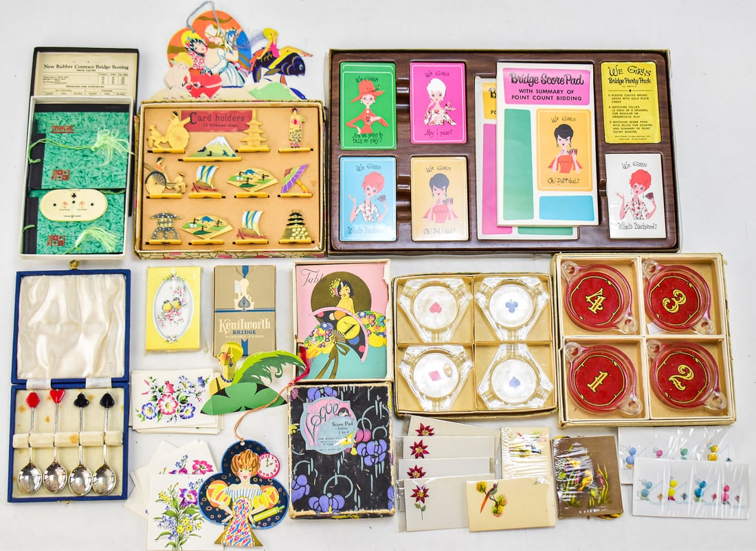 ANTIQUE & VINTAGE GAMING ITEMS: BRIDGE, PLAYING CARDS, CARD HOLDERS, ASHTRAYS: A large assortment of antique and vintage gaming items including a Whitman Publishing "We Girls Bridge" party set from the 1960s, an assortment of antique cards and game tally score cards, a set of Ke
