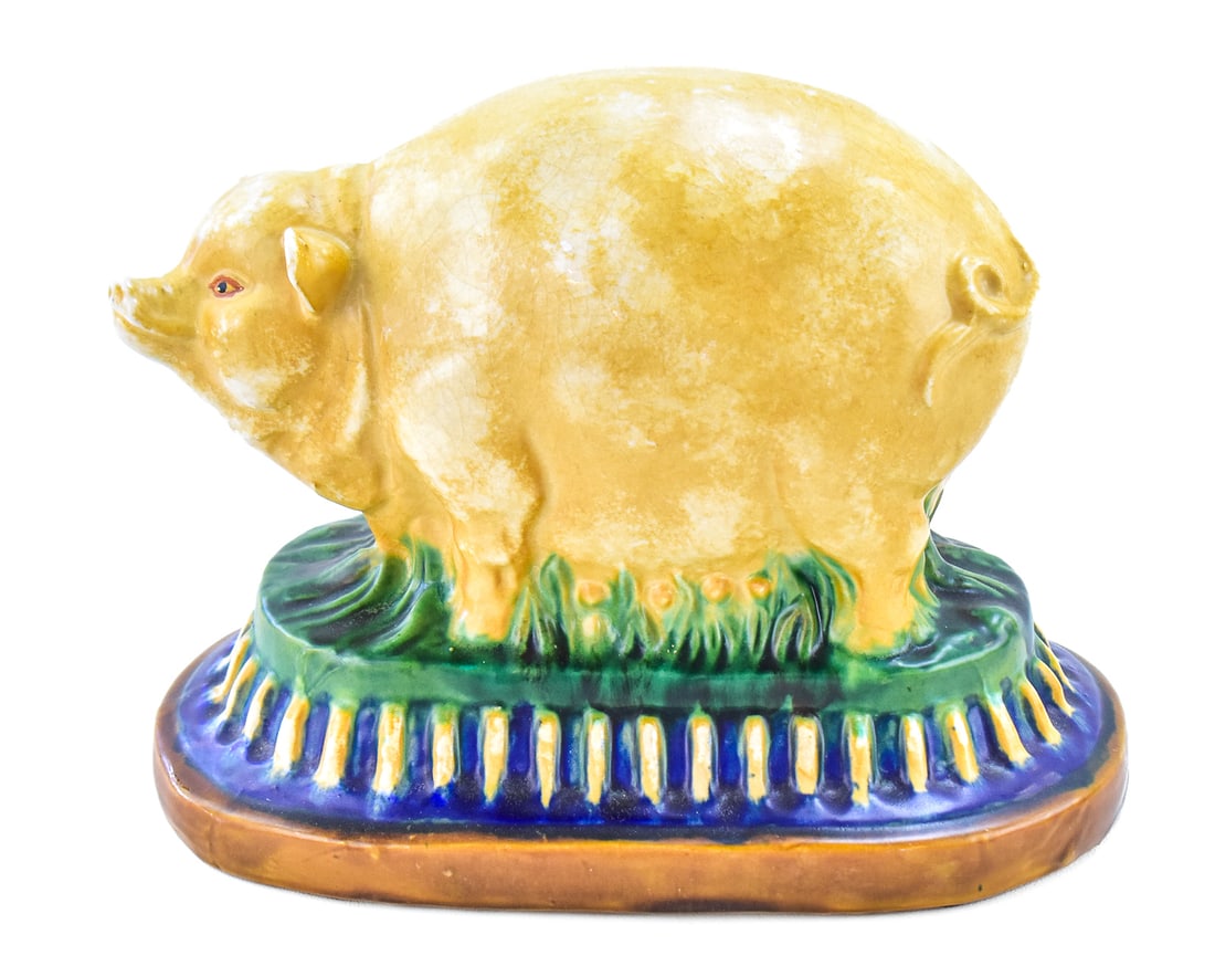 FOLK ART PIG STATUE: This pig is ceramic in material and made some time in the mid 20th century. The pig measures approx. 10" H x 11" W x 6.5" D.