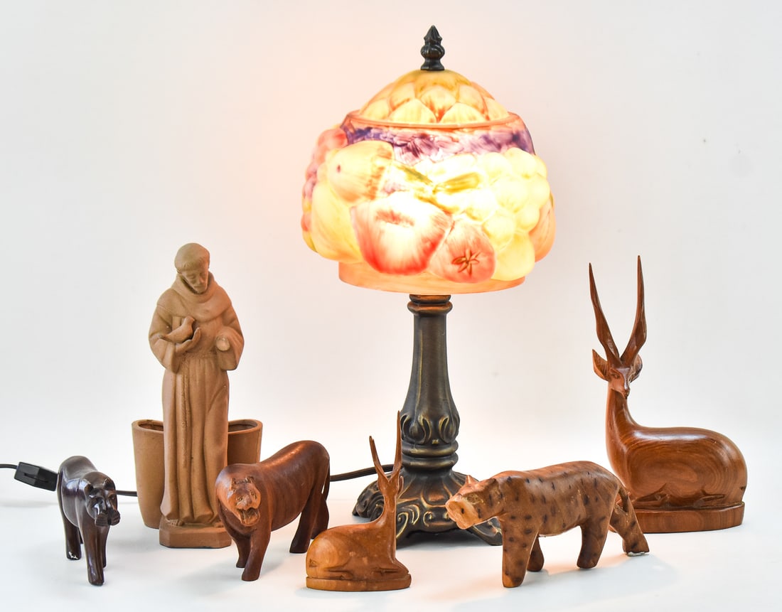 PAIRPOINT-STYLE PUFFY FRUIT LAMP & ASSORTMENT OF WOOD & CLAY DECORATIVE FIGURES: A vintage Pairpoint-style puffy fruit lamp, and assortment of carved wood animals including three lions and two antelopes, and a clay vase or flower pot with a figure of St. Francis of Assisi holding 