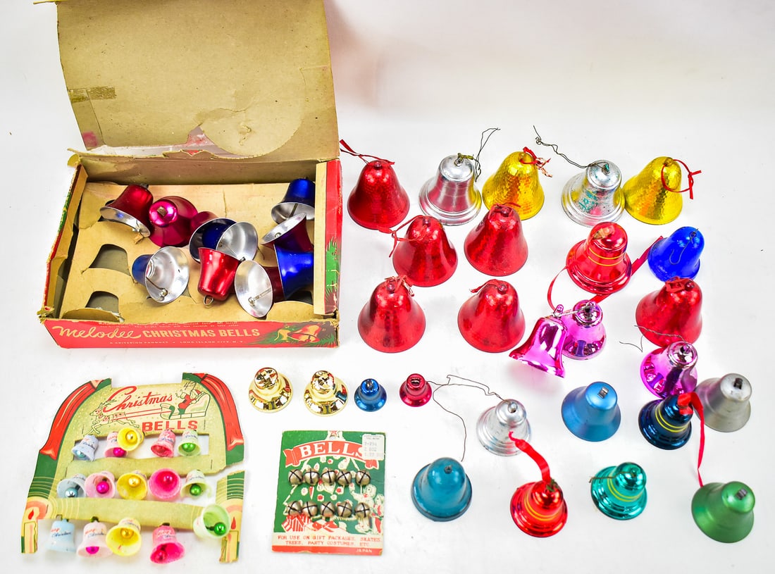 ASSORTMENT OF CHRISTMAS BELL DECORATIONS: MELODEE: A large assortment of plastic and metal Christmas bell decorations including a box of Melodee metal Christmas bells, a small set of Melodee glittered plastic Christmas bells, a pack of small sleigh be