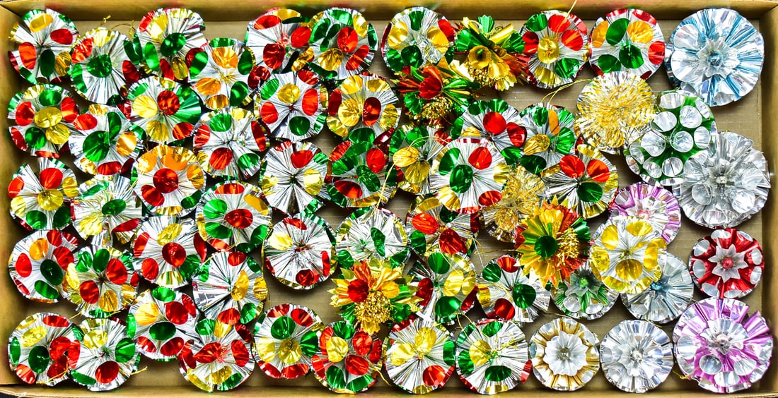ATOMIC FOIL POM POM CHRISTMAS ORNAMENT ASSORTMENT: This lot consists of 60 atomic age foil christmas ornaments. They are made of either crinkle foil or tinsel petals circa 1960s. Average measurement is approx. " H x 3" W x 3" D.