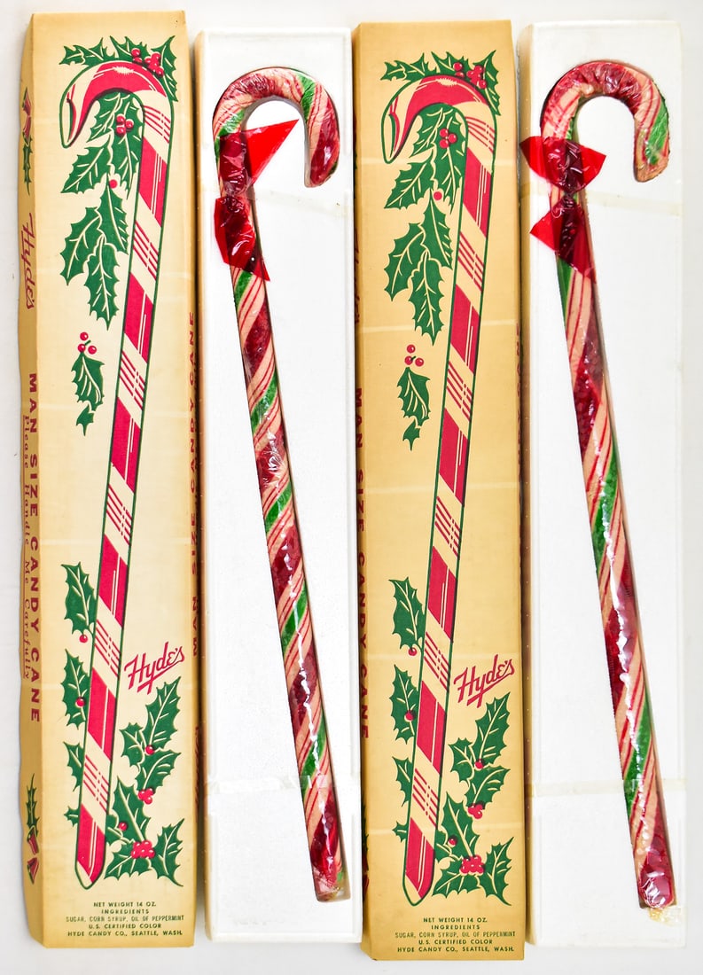 PAIR OF "MAN SIZE" CANDY CANES FROM HYDE CANDY CO.: These are two vintage candy canes with their original boxes circa mid 20th century. They were produced by Hyde Candy Company in Seattle, Washington and weighed just under a pound each. Each box