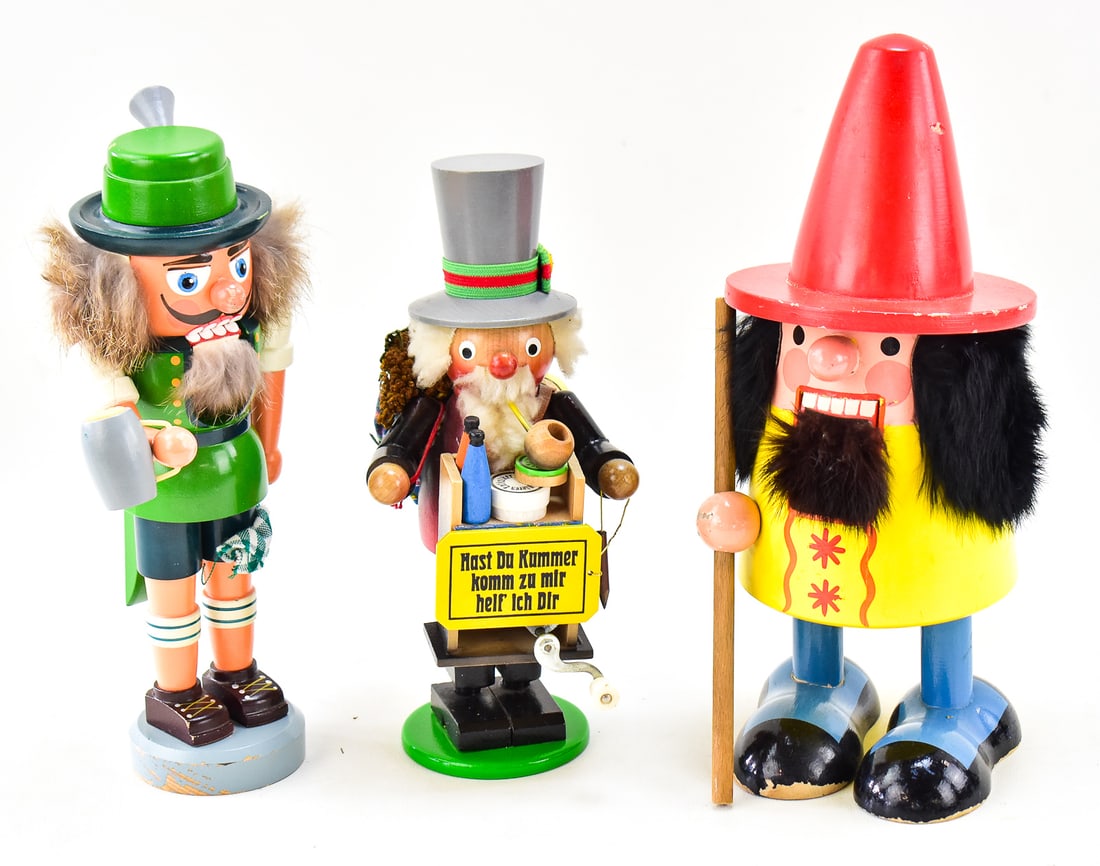 GERMAN CARVED WOODEN NUTCRACKERS & INCENSE SMOKER: This lot consists of three German carved wooden figures. Figure one is an Oktoberfest beer drinker nutcracker. This is marked with the stamp for VEB Holz-und Drechslerwaren Rothenthal in the (former)