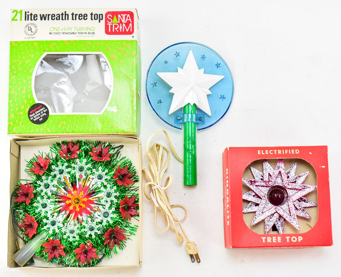 LIGHT UP TREE TOPPER TRIO: This lot has three light up tree toppers in it. Topper one is a Ringalite electrified tree top five inch triple jeweled star. Model number 4809 with its original box circa 1960s. Topper two is a Santa