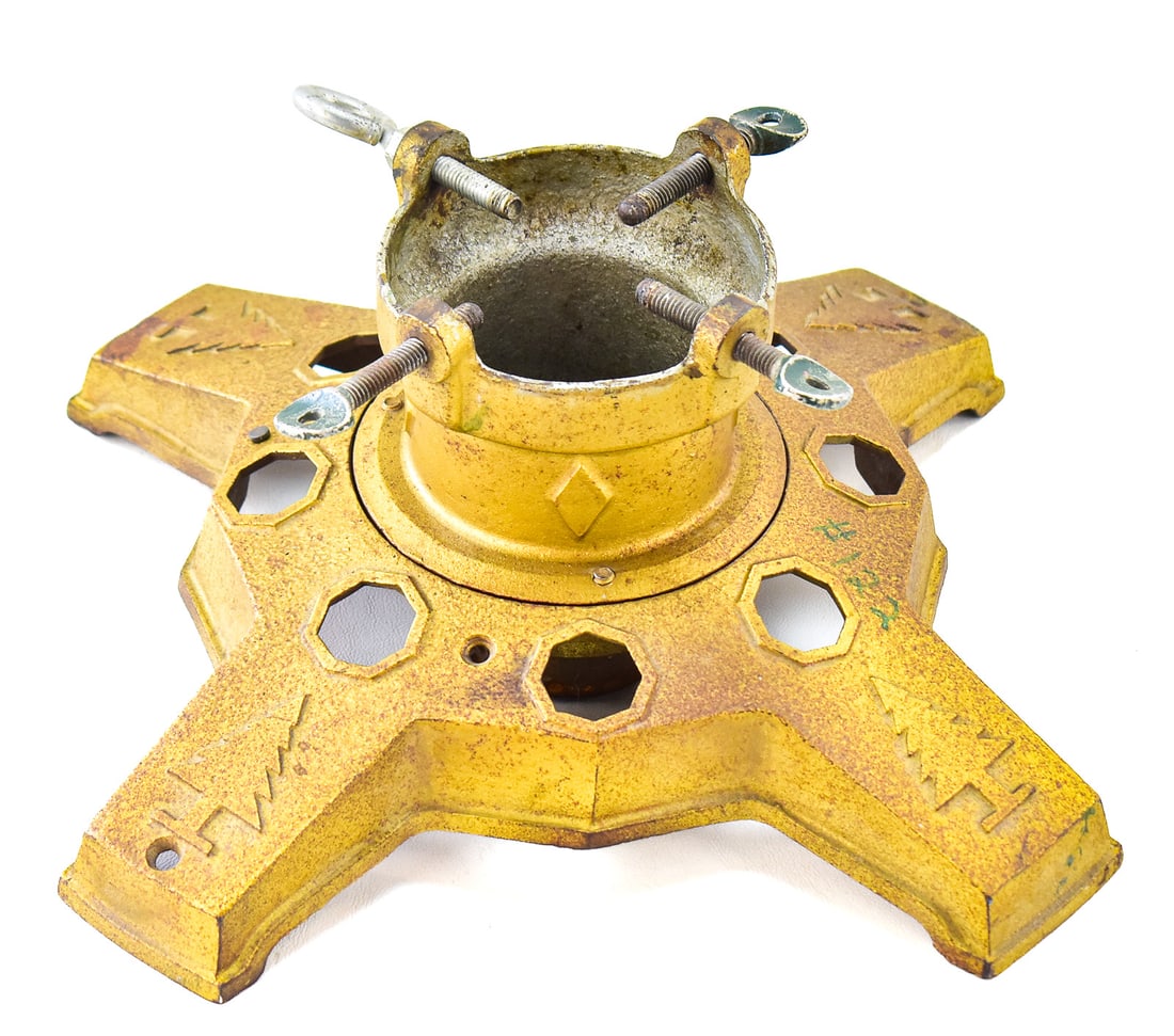 NORTH BROTHERS "YANKEE" CAST IRON CHRISTMAS STAND: This tree stand was manufactured by the North Bros. Mfg. Co in Philadelphia, Pennsylvania circa 1930s. It is made of cast iron and painted gold. It measures approx. 7.5" H x 11" W x 11" D.