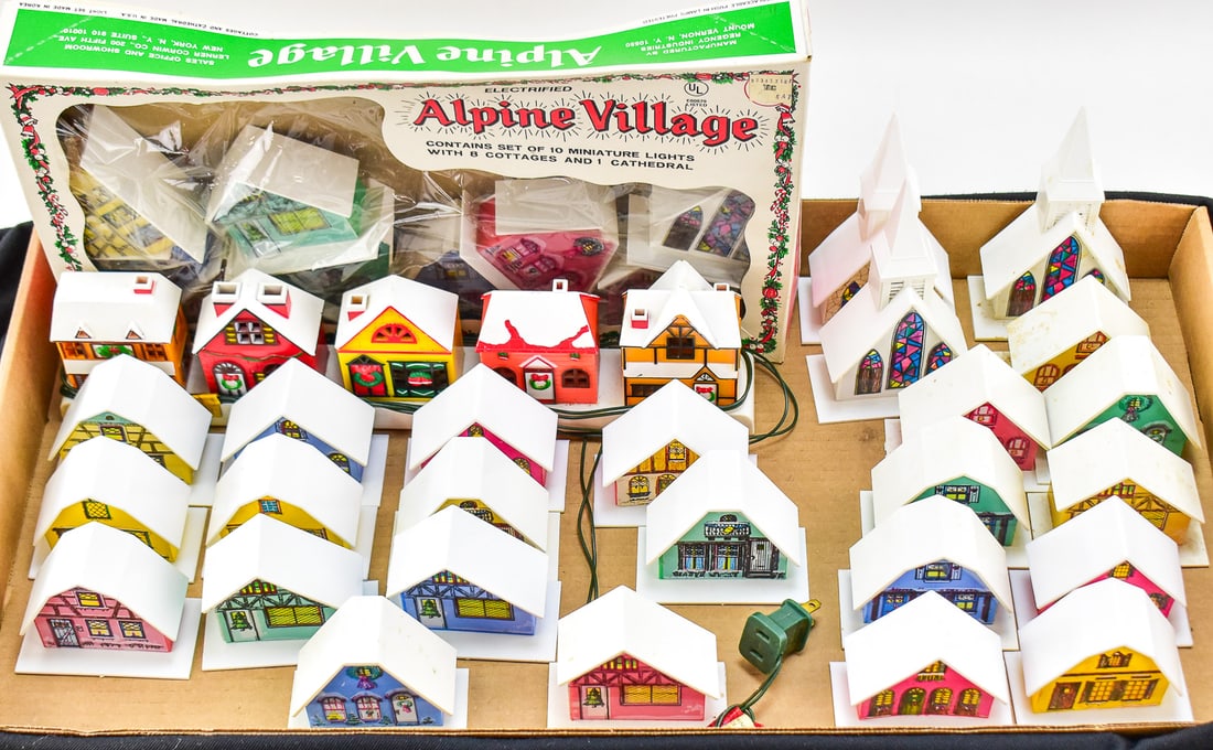 FOUR ELECTRIFIED ALPINE VILLAGES: This collection has four electrified alpine village string lights manufactured by Regency Industries in the United States of America between 1960-1970. The original box measures approx. 2" H 15.5" W x