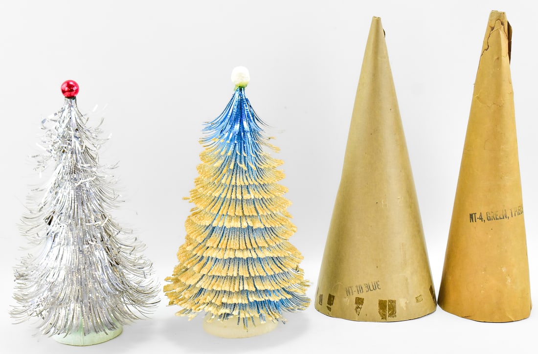 ALUMINUM TINSEL EYELASH CHRISTMAS TREE PAIR: This lot has two aluminum tinsel Christmas trees. Both have the white flocking on the edges and were crafted in the mid 20th century. The larger tree measures approx. 17.5" H x 7" W x 7" D.