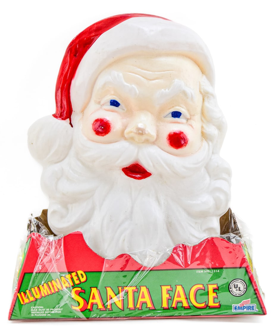 EMPIRE PLASTIC CORPORATION ILLUMINATED GIANT SANTA FACE BLOW MOLD: This Santa blow mold comes in its original packaging. It was manufactured by Empire Plastic Corporation Illuminated in Tarboro, North Carolina c.1960s. Santa measures approx. 15" H x 17.5" W x 5.5" D.