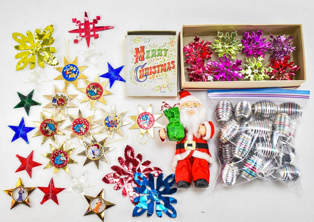 CHRISTMAS ORNAMENT ASSORTMENT & SANTA DOLL: This assortment has 8 gold foil stars with painted angel centers, 8 hard plastic stars in various colors, 2 hollow gold stars with 3D angel centers, 12 atomic foil snowflake ornaments, 19 Bradford
