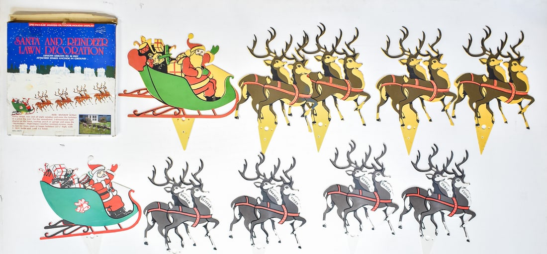 UNION PLASTICS SANTA SLEIGH AND REINDEER PLASTIC LAWN STAKE SET: A Union Plastics flat-molded plastic with integrated light sockets and holder on the back, circa 1970s. Comes with its original box which measures approximately 19" H x 18" W x 1.5" D.