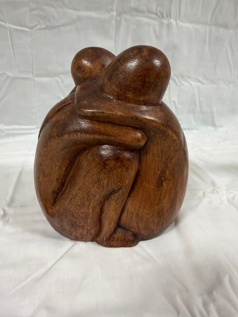 Hand Carved Wood: Hand carved wooden sculpture depicting an embracing couple: 7'X5"
