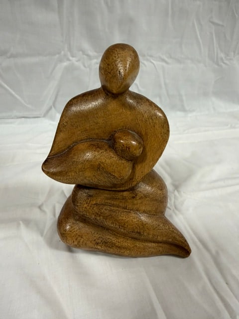 Wood Carved: Wood scultpture depicting a mother and child