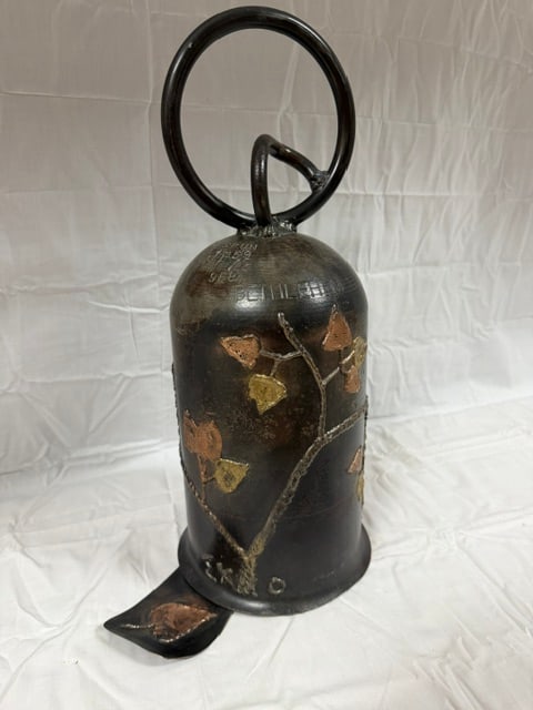 Vintage Pottery Bell: Vintage ceramic pottery bell with metallic glaze; "Bethlehem" inscription, "spun" date; 17" X 6"