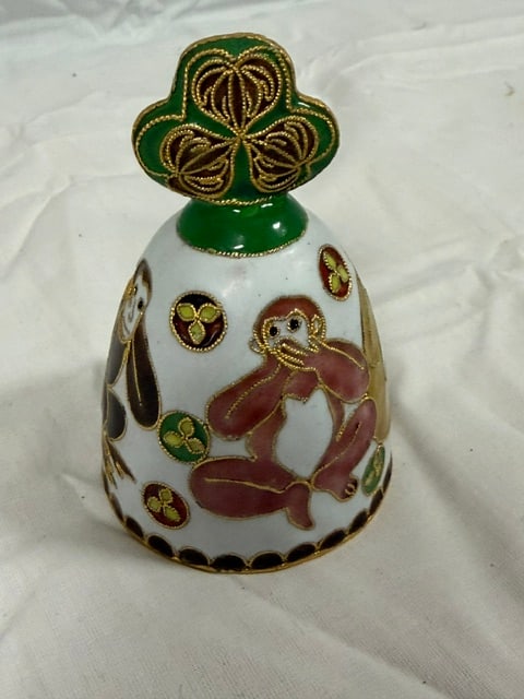 Hand Bell: Cloisonne enamel hand bell with monkey motif and shamrock handle