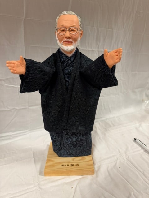 Doll/Puppet: Collectible doll/puppet of Japanese anime creator Hayao Miyazaki wearing traditional haori jacket; 14.4" H