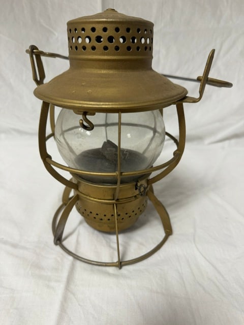 Brass Railroad Lantern: Brass railroad lantern with wire cage and clear glass globe