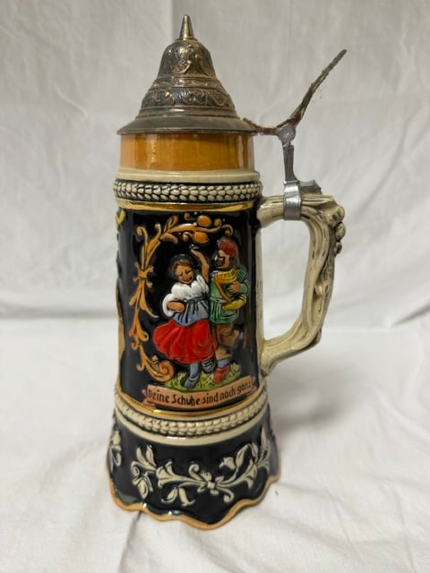Ceramic Beer Stein: Ceramic beer stein with pewter lid and musical mechanism, featuring hand-painted German folk scene