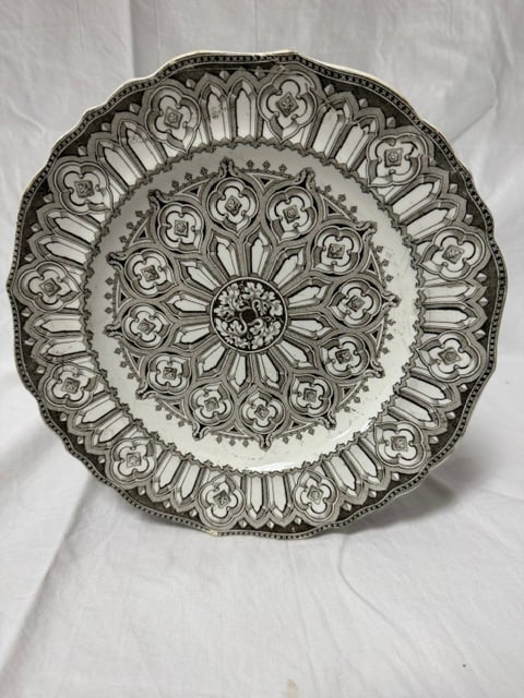 Decorative Ceramic Plate: Decorative ceramic plate with ornate geometric and floral pattern in black and white