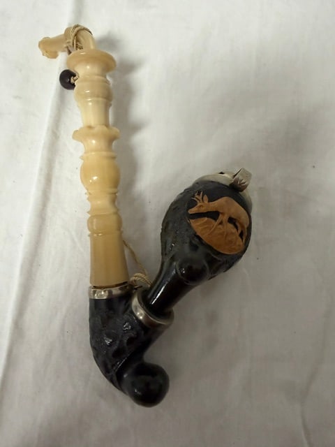 Carved Ivory Pipe: Carved bone and ivory pipe with figural bowl depciting a deer grazing