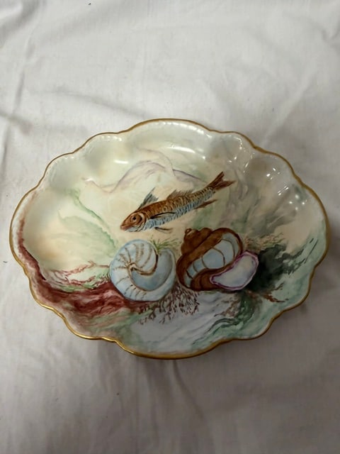 Hand-Painted Fish Plate: Hand-painted porcelain fish plate with scalloped rim and gilt edge