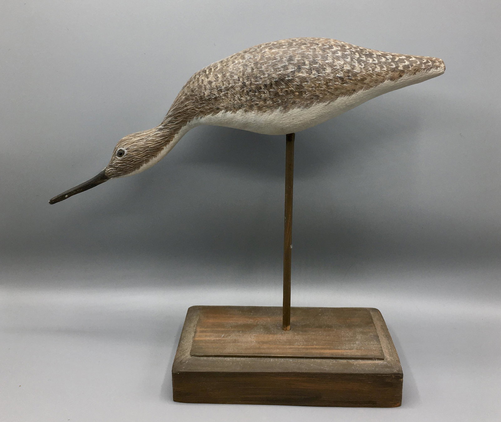 Greater Yellowlegs by Rubolinos: A 14 inch feeding shorebird decoy by the Rubolinos, Brockton, MA. Signed and dated 1977. In original paint with minor wear.