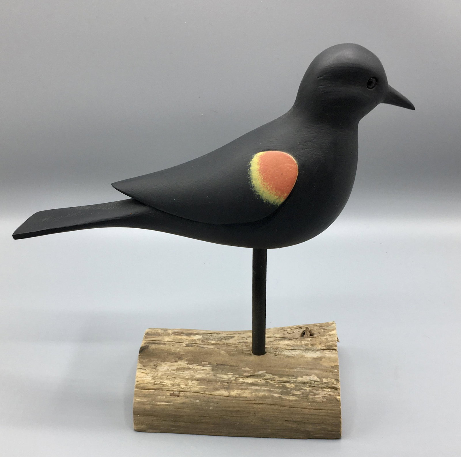 Red-Winged Blackbird by Jamie Hand: A 9 1/2 inch Bilackbrd decoy by Jamie Hand of Cape May, NJ, signed on the underside of the bird. In original paint with minimal wear.