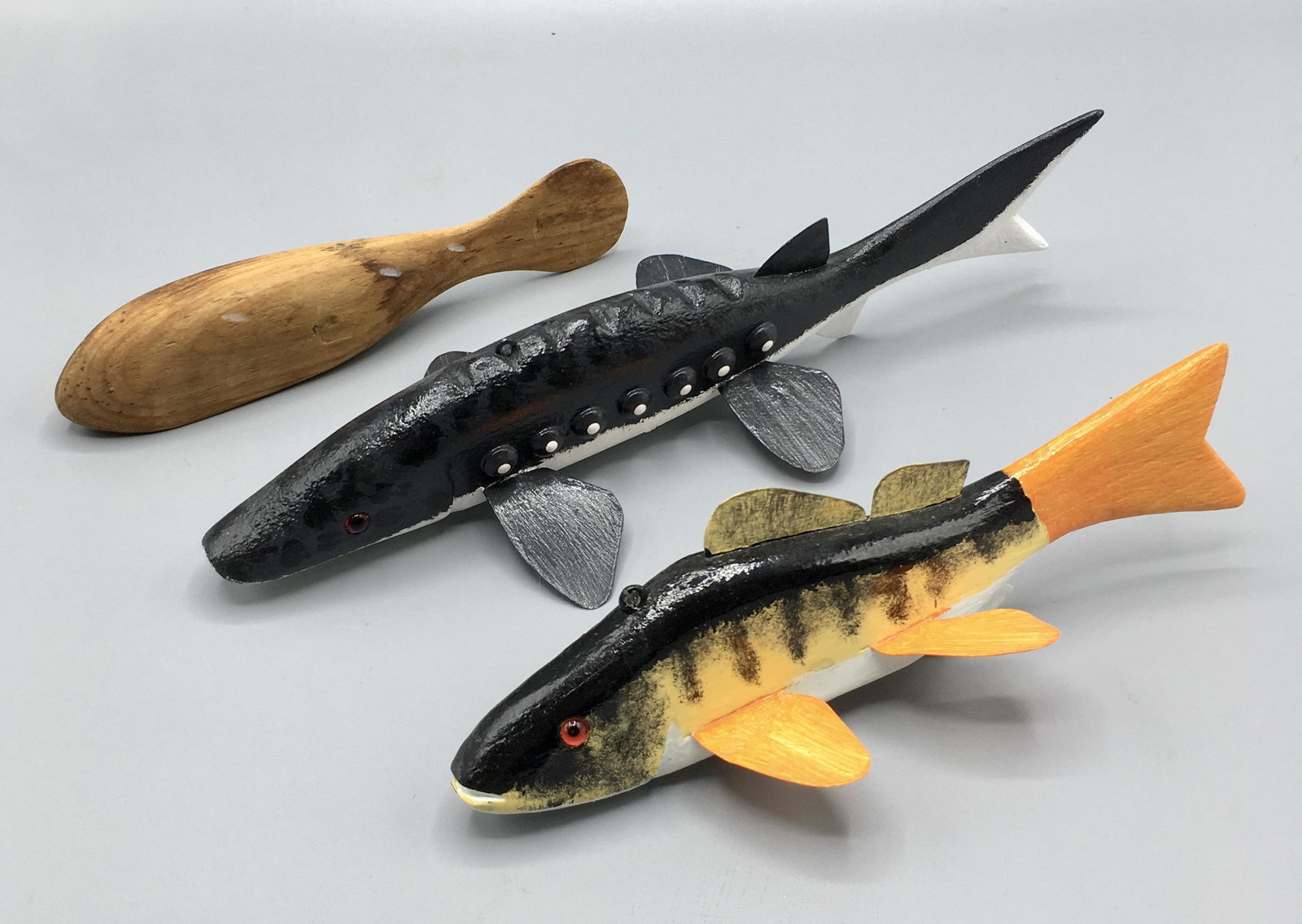 Two Fish Decoys by Duane Turnock: A 10 and a 7 1/2 inch fish decoys by Duane "Buzz" Turnock (b.1942),Goshen, Indiana.and one blank in natural wood. In original paint with minor wear.