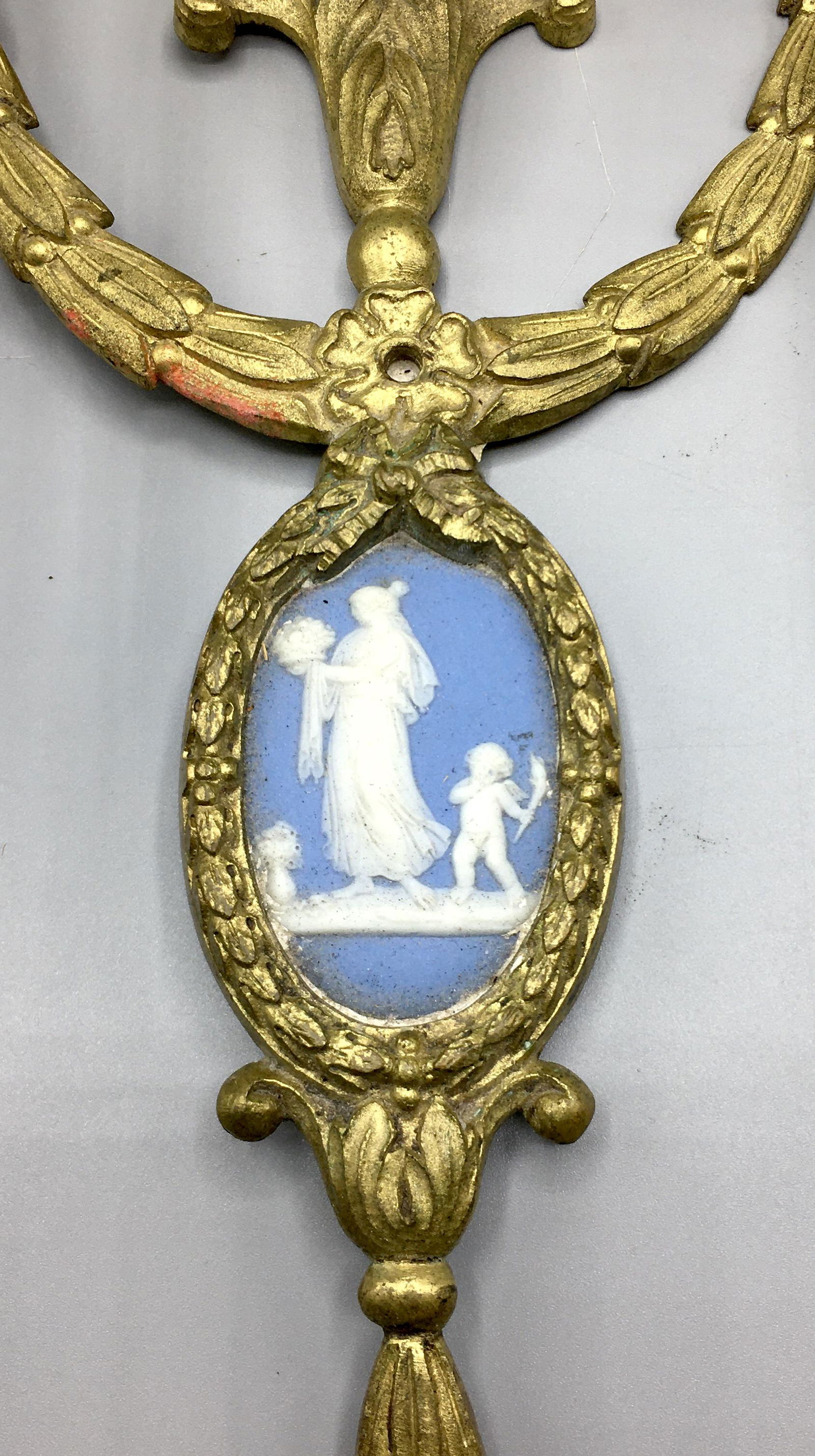 Brass Sconces with Wedgewood Medallions: Two 12 3/4 inch sconces with one plastic light bulb sleeve missing and another damaged. Signed Wedgewood on the back of the medallions.