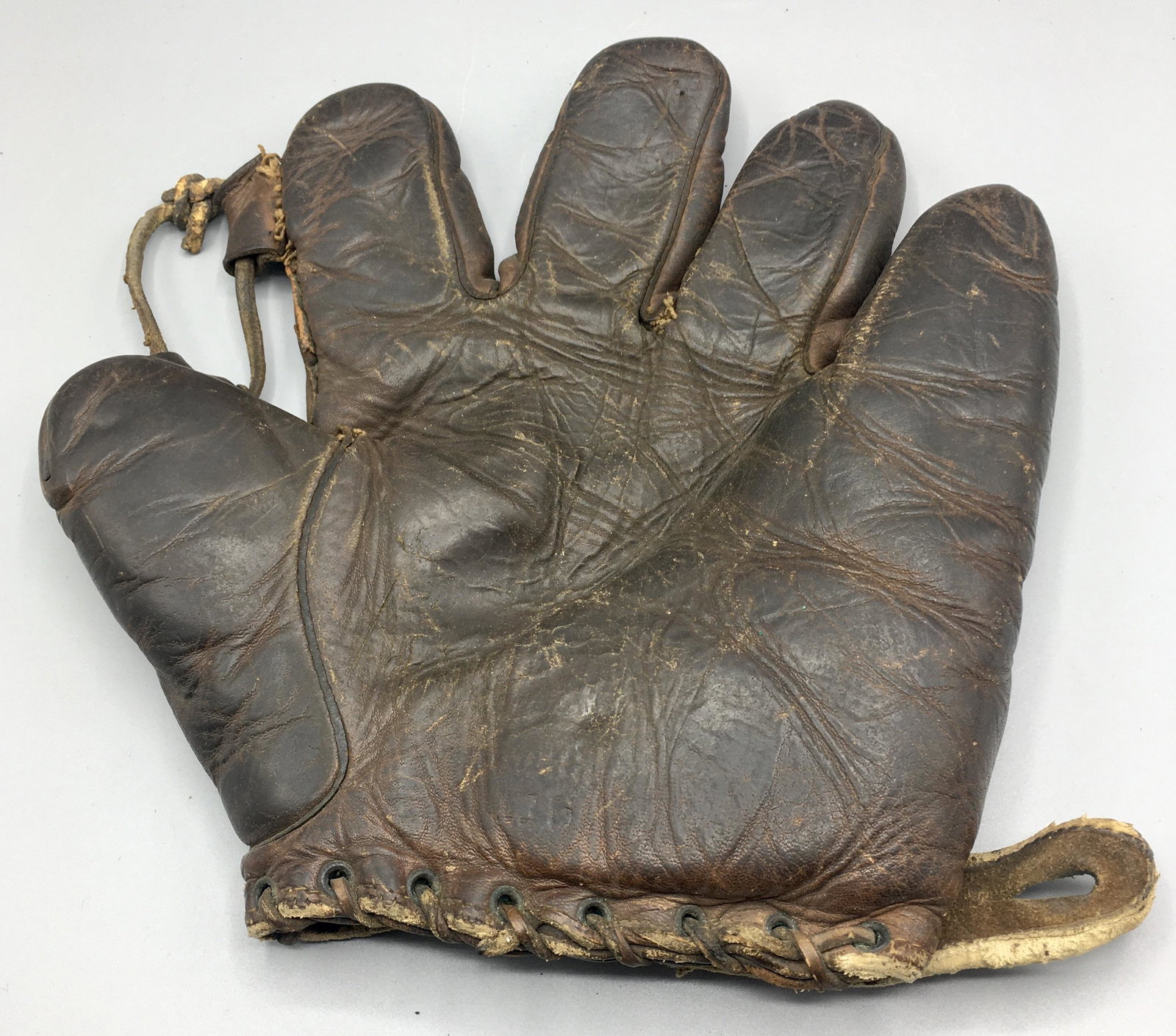 Two Old Baseball Gloves: A 9 1/2 by 9 1/2 inch Baseball Glove by Dave G of New York and a 9 3/8 by 9 1/2 Baseball glove by AlexTaylor & Co, NY.