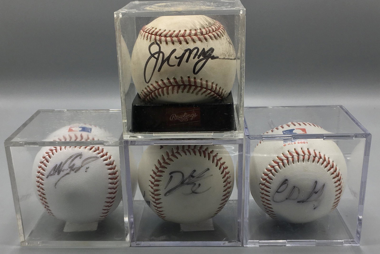 Boston Red Sox Autographed Baseballs: Four, signatures include Nomar Garciaparra and Derek Lowe.