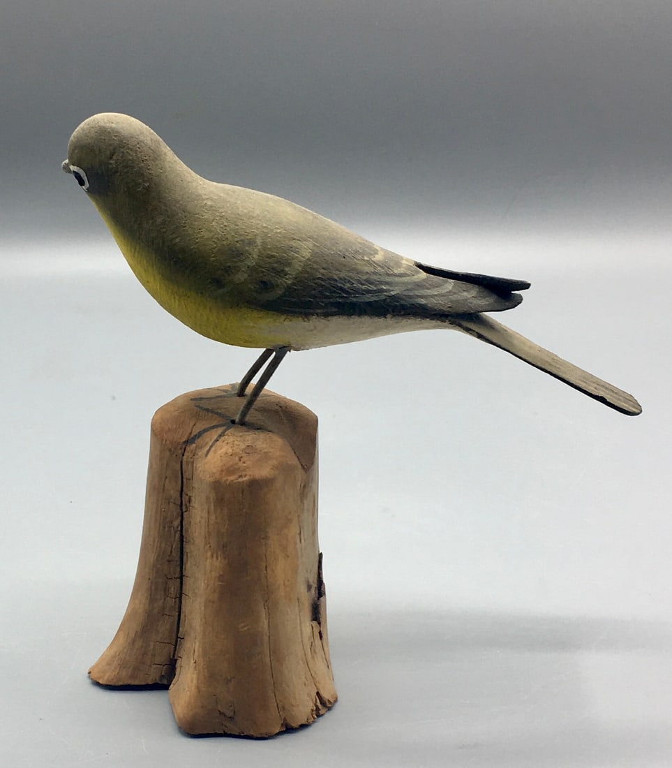 Yellow-Breasted Chat by Peltz from Cape Cod: A 5 3/4 inch bird carving by Peter Peltz (1915-2001), Sandwich, Cape Cod, MA. In original paint with wear, a portion of the tail is missing.