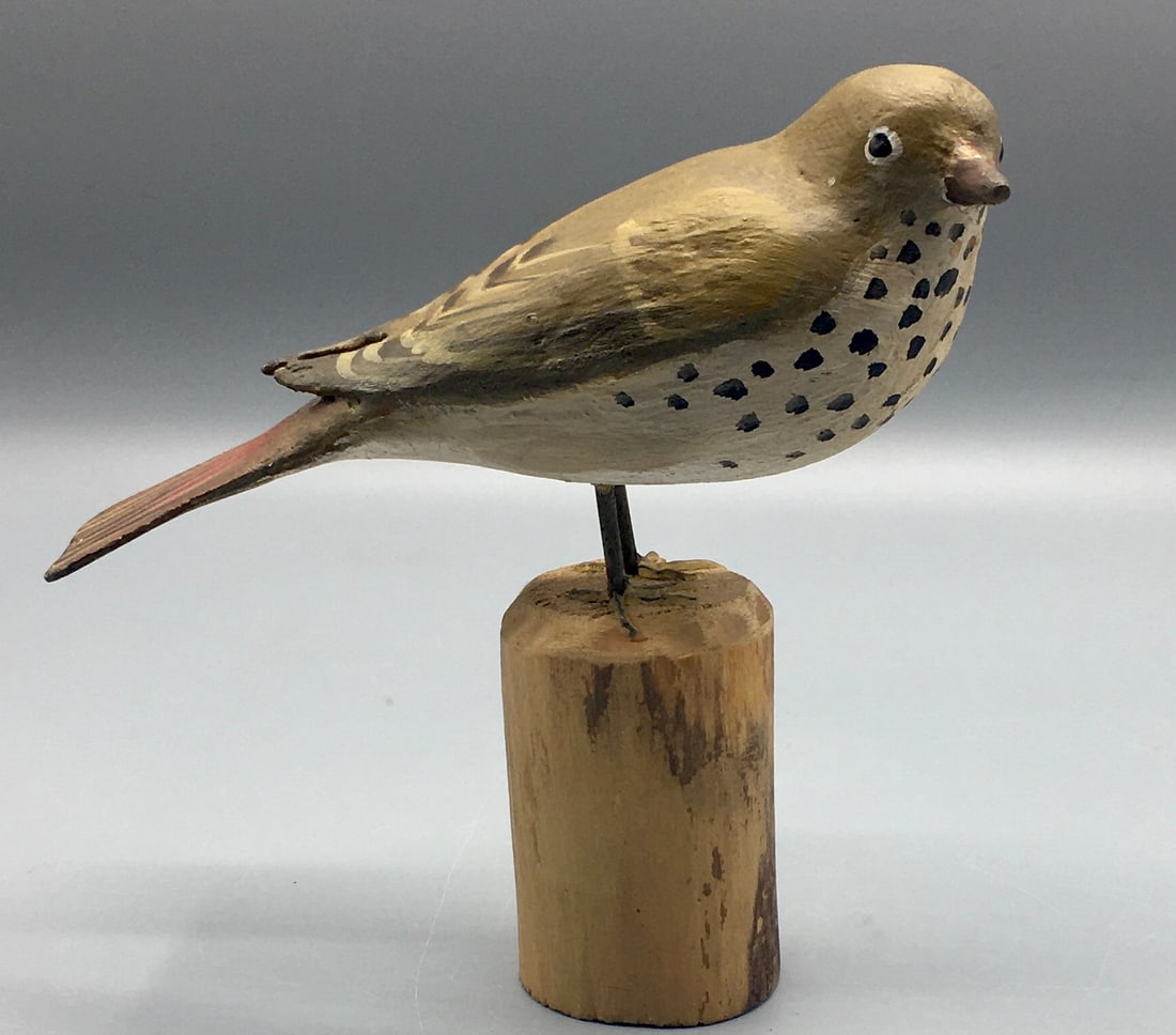 Hermit Thrush by Peltz: A 6 inch bird carving by Peter Peltz (1915-2001), Sandwich,Cape Cod, MA. Signed on the bottom of the base with species identification. Original paint with minor wear.