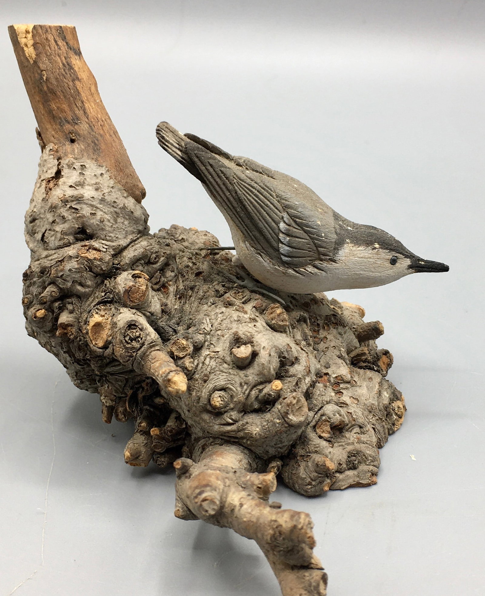 Miniature White-Breasted Nuthatch by Sawdo: A 2 1/2 inch miniature Nuthatch carving by Richard "Doc" Sawdo (1947-2008), Falmouth, Cape Cod, MA. Unsigned. Original paint with minor wear and a few tiny fly specs.