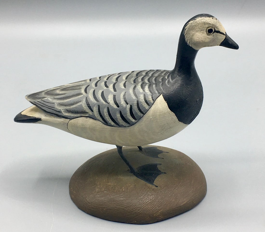 Miniature Barnacle Goose by James Lapham: A 5 inch Barnacle Goose carving by James Lapham (1908-1987), Dennisport, Cape Cod, MA. Signed on the bottom with Sear's Family oval Lapham brand. Original paint with minimal wear.