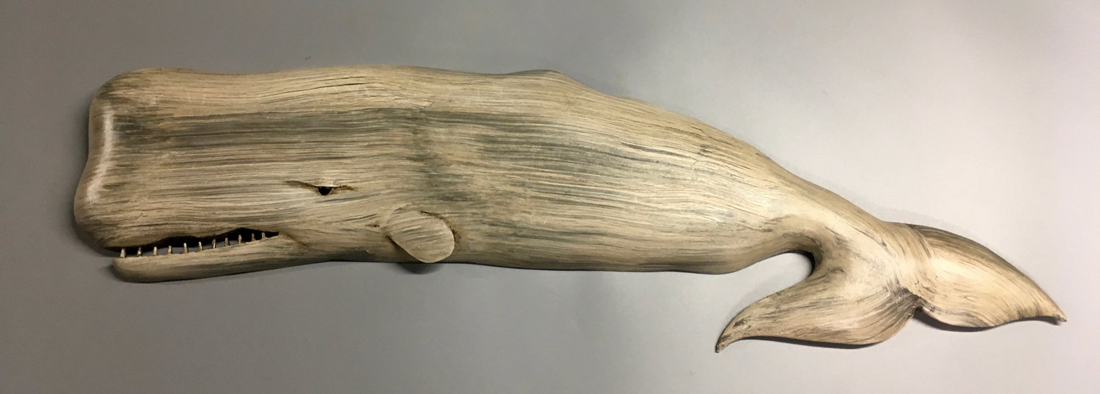 White Whale by Brian Mitchell: A 24 inch whale plaque carving - hand carved and hand painted by Brian Mitchell of North Carolina. Signed on the back by the maker. Original paint and condition.