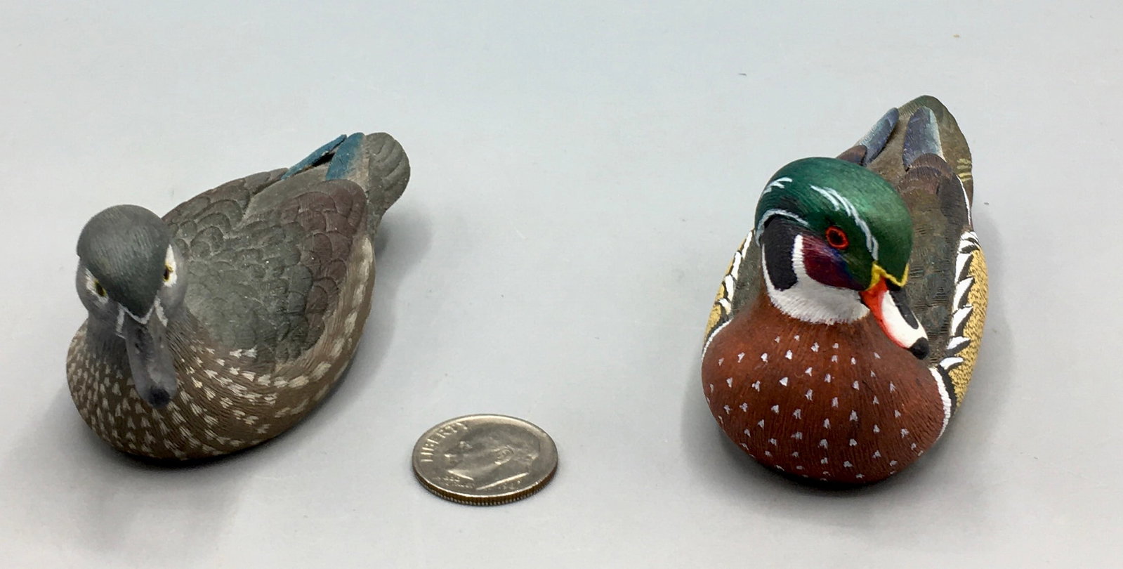 Pair of Miniature Wood Ducks by Jan Fitch: A pair of 3 1/4 inch miniature Wood Ducks by Jan Fitch, Wolfe Island, Ontario, Canada. signed and dated 1998 on the bottom. Jan has won best of show ribbons both in American and Canadian bird carving 