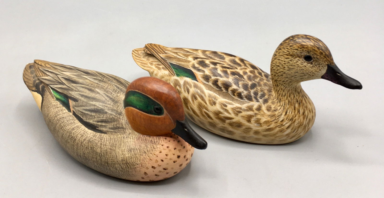 Miniature Pair of Green-Winged Teal by Robert Kerr: A fine pair of 5 1/2 inch miniature Green-Winged Teal duck decoys by Robert G. Kerr (b.1935), Smith Falls, Ontario, Canada, signed and dated 1978 on the bottom of each decoy. In original condition.
