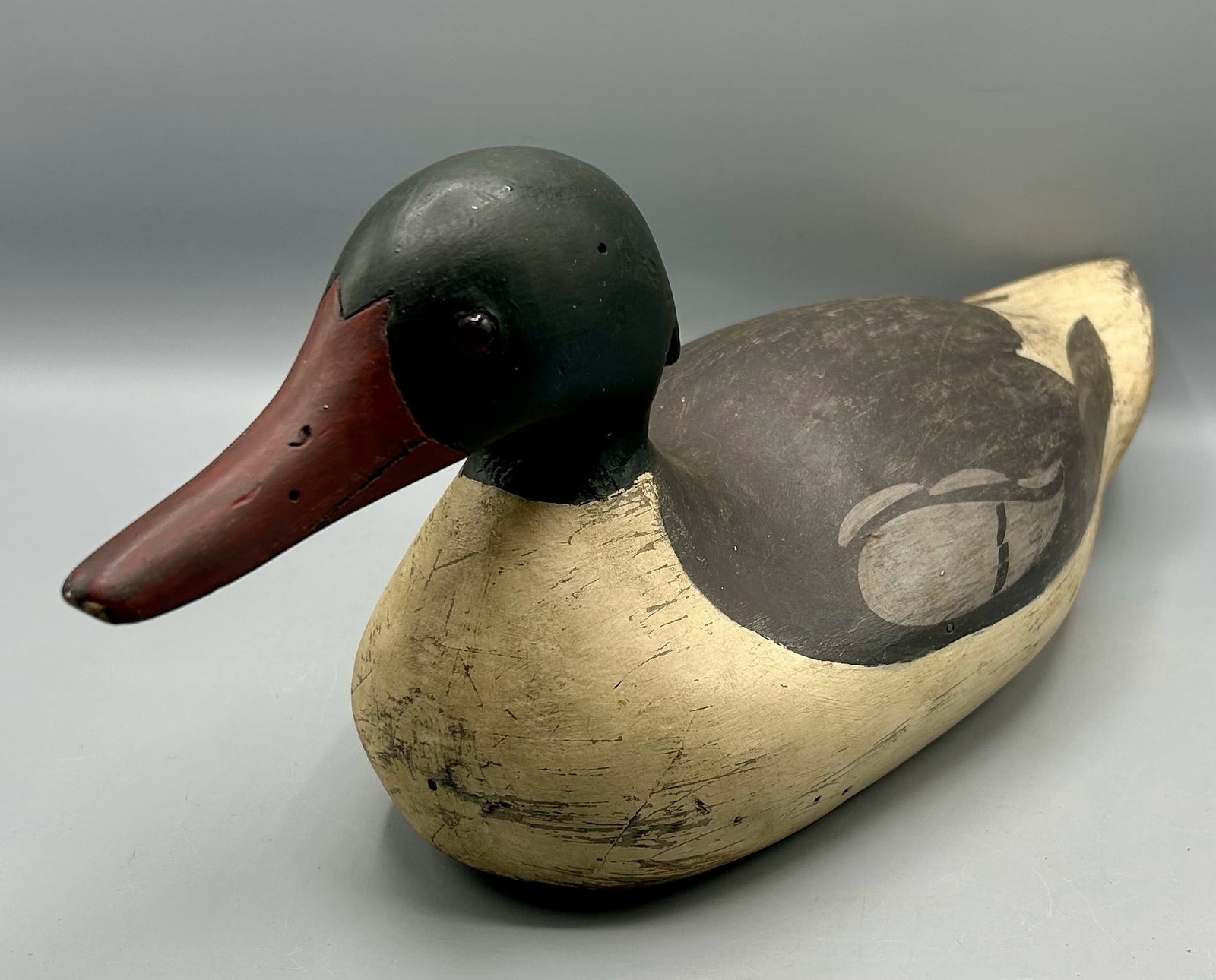Mason Style Merganser Drake attr. to Burkhard: A 17 1/2 inch Merganser deooy attributed to Burkhard, whose name is stamped in the weight. A"PHW' rig stamp is also on the bottom.. As found : with expected wear for its age.