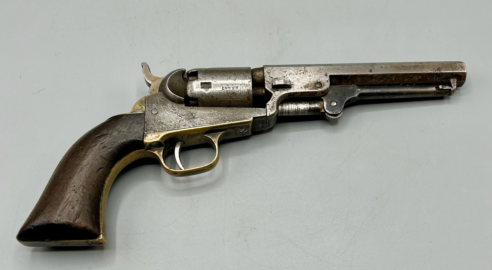 An Antique 1849 Colt Pocket Pistol: A 10 inch 1849 Colt Percussion Pocket Pistol, a 31 caliber black powder pistol. Top of the 5 inch barrel reads "Address Col SamL Colt New York City," "Colts Patemt is on one side of the frame, the cyl